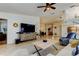 Inviting living room boasts a large television, decor accents, ceiling fan, and ample space at 4967 162Nd N Ave, Clearwater, FL 33760