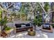 Screened patio with comfortable seating arrangement and lush landscaping at 4967 162Nd N Ave, Clearwater, FL 33760