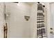 White subway tile shower with a decorative, built-in alcove and bronze fixtures at 4967 162Nd N Ave, Clearwater, FL 33760
