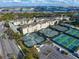 Overhead view of the complex featuring tennis courts and waterfront in the distance at 501 Knights Run Ave # 2101, Tampa, FL 33602