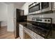 Modern kitchen featuring stainless steel appliances and granite countertops at 501 Knights Run Ave # 2101, Tampa, FL 33602