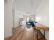 Bright living room with modern decor, hardwood floors, and sliding glass doors to a balcony at 501 Knights Run Ave # 2101, Tampa, FL 33602