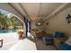 Outdoor lounge area features comfortable seating, a view of the pool, and a mounted TV at 501 Knights Run Ave # 2101, Tampa, FL 33602