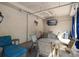 Comfortable patio with lounge chairs, tables, and a TV, perfect for relaxation and entertainment at 501 Knights Run Ave # 2101, Tampa, FL 33602