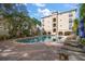 Relaxing pool area with lounge chairs and tropical landscaping at 501 Knights Run Ave # 2101, Tampa, FL 33602