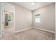 Bedroom with neutral walls, carpet, ceiling fan, and ample natural light at 5087 San Martino Dr, Wesley Chapel, FL 33543