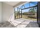 Covered patio with black frame and tile flooring, perfect for outdoor entertaining at 5087 San Martino Dr, Wesley Chapel, FL 33543