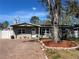 Charming single-story home featuring a brick driveway, front yard tree and neutral exterior paint at 5461 85Th N Ter, Pinellas Park, FL 33781