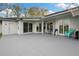 Large backyard with a patio, ideal for relaxation and outdoor entertainment at 6140 Silver Oaks Dr, Zephyrhills, FL 33542