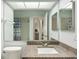 Well-lit bathroom with granite countertop, offering a stylish and functional space at 6140 Silver Oaks Dr, Zephyrhills, FL 33542