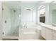 Bright bathroom showcasing a walk-in shower and separate soaking tub at 6140 Silver Oaks Dr, Zephyrhills, FL 33542