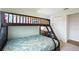 Charming bedroom featuring a cozy bunk bed, creating a functional and inviting space at 6140 Silver Oaks Dr, Zephyrhills, FL 33542