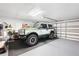 Spacious garage featuring a car, perfect for vehicle storage and DIY projects at 6140 Silver Oaks Dr, Zephyrhills, FL 33542