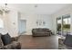 Bright living room with slider doors, stylish furniture, and contemporary décor at 6140 Silver Oaks Dr, Zephyrhills, FL 33542