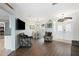 Inviting living room with hardwood floors, white walls, and a view of the front entrance at 6140 Silver Oaks Dr, Zephyrhills, FL 33542