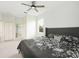 Spacious main bedroom with a queen size bed and an ensuite bathroom at 6140 Silver Oaks Dr, Zephyrhills, FL 33542