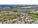 Aerial view of a community with lakes, green spaces and solar panels at 6810 Guilford Crest Dr, Apollo Beach, FL 33572