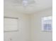 Bright bedroom features two windows with blinds and a ceiling fan at 7847 39Th N Ter, St Petersburg, FL 33709
