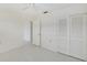 Clean bedroom with white walls, tile floors, and built-in closet at 7847 39Th N Ter, St Petersburg, FL 33709