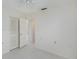 Serene bedroom with white walls, a ceiling fan, and tile floors at 7847 39Th N Ter, St Petersburg, FL 33709