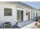 Exterior view of a well-maintained home with a sliding glass door and window at 7847 39Th N Ter, St Petersburg, FL 33709