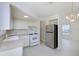 Bright kitchen with modern appliances, including a stainless-steel refrigerator and a gas range at 7847 39Th N Ter, St Petersburg, FL 33709