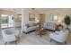 Bright living room with modern furniture, neutral tones, and an open layout creating an inviting space at 7847 39Th N Ter, St Petersburg, FL 33709