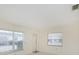 Bright living room featuring two windows that allow for natural light to fill the room at 7847 39Th N Ter, St Petersburg, FL 33709