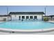 Inviting community swimming pool with clear blue water and surrounding lounge chairs at 7847 39Th N Ter, St Petersburg, FL 33709