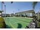 Community shuffleboard courts with manicured landscaping, benches, and clubhouse in a well-maintained community at 7847 39Th N Ter, St Petersburg, FL 33709