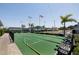 Well-maintained shuffleboard courts at the community with benches and an American flag at 7847 39Th N Ter, St Petersburg, FL 33709