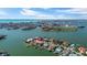 Aerial view of waterfront neighborhood featuring bay views, multiple docks, and beautifully landscaped yards at 7986 9Th S Ave, St Petersburg, FL 33707