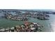 Aerial shot showcases the home's location on a waterfront peninsula with stunning views at 7986 9Th S Ave, St Petersburg, FL 33707