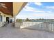 Spacious balcony with detailed railings offers stunning waterfront views and an outdoor living space at 7986 9Th S Ave, St Petersburg, FL 33707