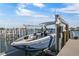 This boat is on a boat lift, ready for fun on the water in this waterfront community on a sunny day at 7986 9Th S Ave, St Petersburg, FL 33707