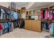 Spacious walk-in closet with custom shelving, hanging racks, and drawers for organized storage of clothing and accessories at 7986 9Th S Ave, St Petersburg, FL 33707