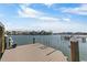 Beautiful waterfront view from the private dock on a sunny day with clear skies and calm waters at 7986 9Th S Ave, St Petersburg, FL 33707