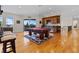 Bright and airy game room boasts a pool table, kitchenette, and scenic views from the sliding glass door at 7986 9Th S Ave, St Petersburg, FL 33707