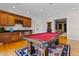 This large game room features a pool table, wet bar, and easy access to other rooms at 7986 9Th S Ave, St Petersburg, FL 33707