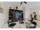 Cozy game room with a large entertainment center, comfortable seating, and an arcade game at 7986 9Th S Ave, St Petersburg, FL 33707