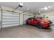 Spacious garage with room for multiple vehicles, featuring epoxy flooring and ample storage space at 7986 9Th S Ave, St Petersburg, FL 33707