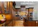Gourmet kitchen with custom wood cabinetry, granite countertops, and stainless steel appliances at 7986 9Th S Ave, St Petersburg, FL 33707