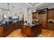 Gourmet kitchen with custom wood cabinetry, granite countertops, and stainless steel appliances at 7986 9Th S Ave, St Petersburg, FL 33707