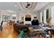 Spacious living room with hardwood floors, recessed lighting, and multiple seating areas at 7986 9Th S Ave, St Petersburg, FL 33707