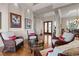 Elegant living room with hardwood floors, high ceilings, and stylish furnishings, perfect for gatherings at 7986 9Th S Ave, St Petersburg, FL 33707