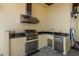 Outdoor kitchen with stainless steel grill, sink, and beverage fridge, perfect for entertaining at 7986 9Th S Ave, St Petersburg, FL 33707