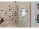 Modern shower with multiple spray options, a built-in seat, and sleek tile design at 7986 9Th S Ave, St Petersburg, FL 33707