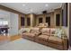 Theater room featuring tiered seating, a projector screen, and a cozy atmosphere, perfect for movie nights at 7986 9Th S Ave, St Petersburg, FL 33707