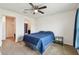 Cozy bedroom with ample natural light, carpet and a ceiling fan at 8034 Broad Pointe Dr, Zephyrhills, FL 33540