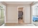 Hallway with tile flooring providing entry to the bathroom and bedrooms in a home at 8034 Broad Pointe Dr, Zephyrhills, FL 33540